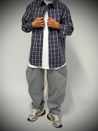 camicia a quadri blu e marrone